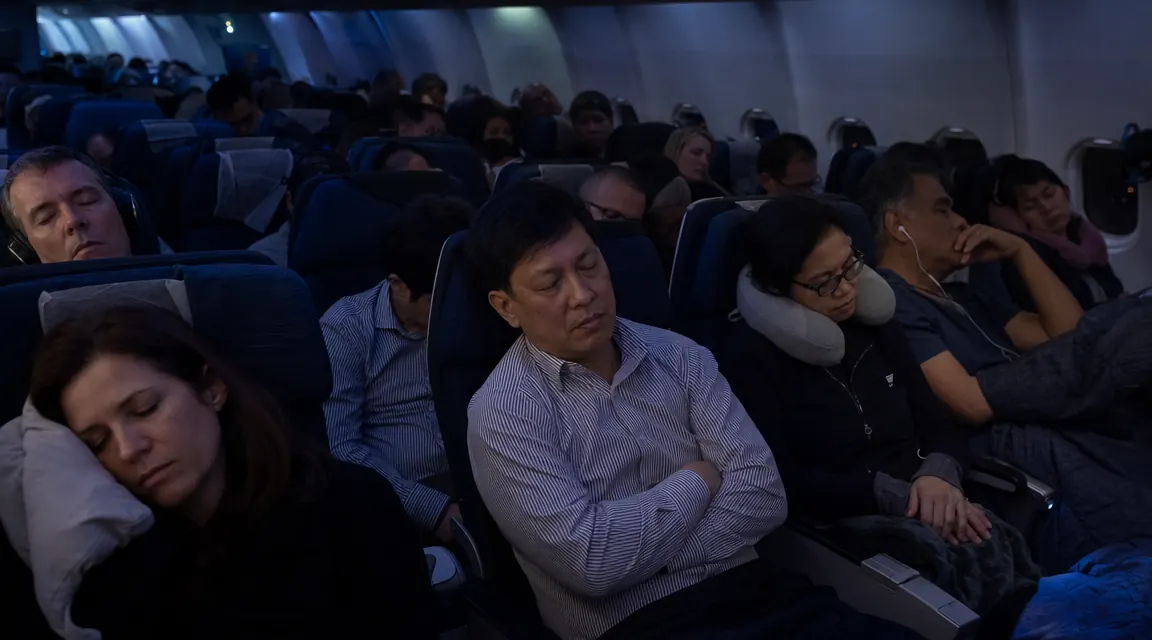 Two travelers of different build sizes wearing the same style memory foam neck pillow on an airplane, showing fit variation